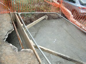 Hole filled with concrete.